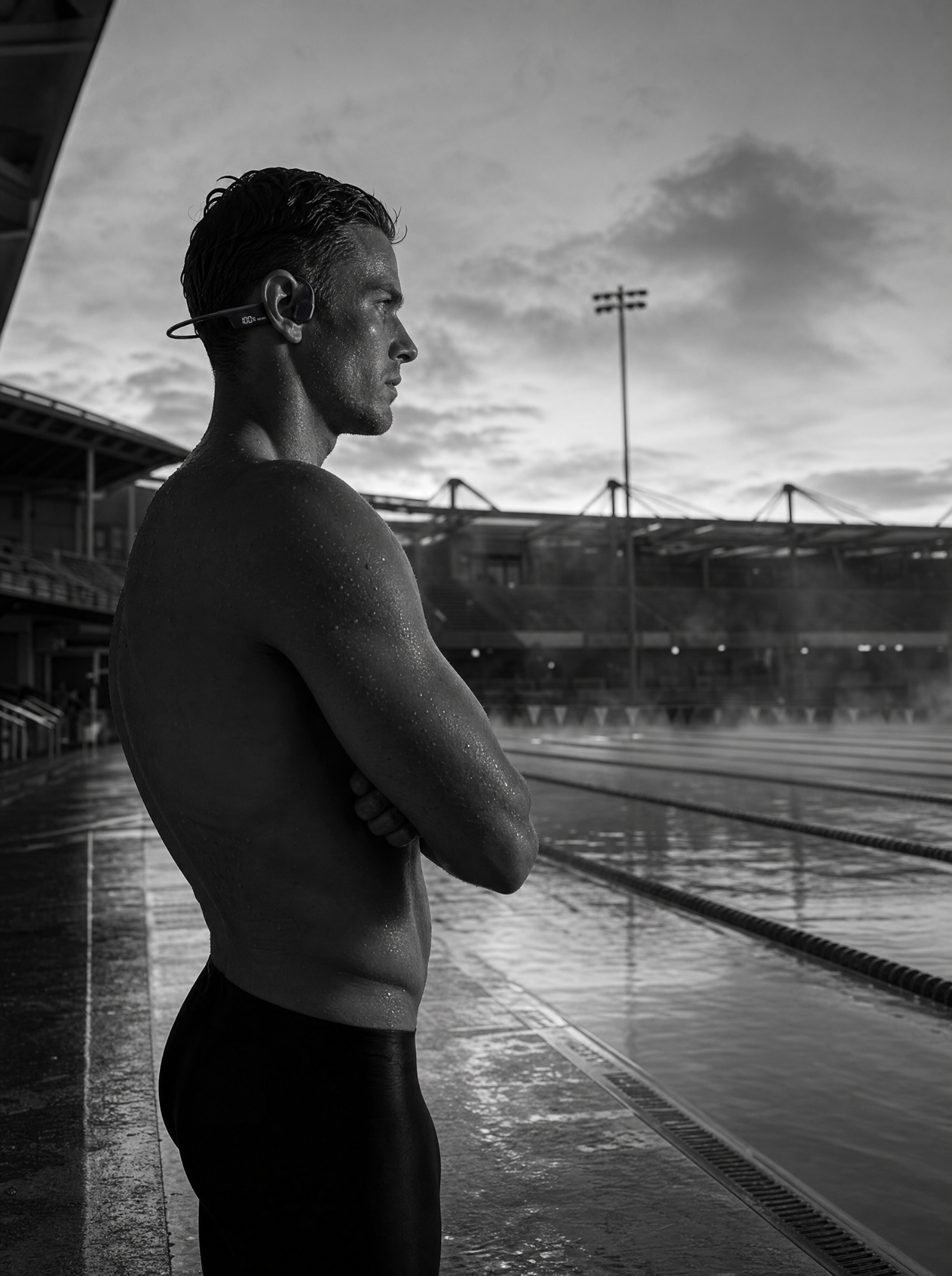 Swimmer on the pool deck at sunrise wearing the BSA-01