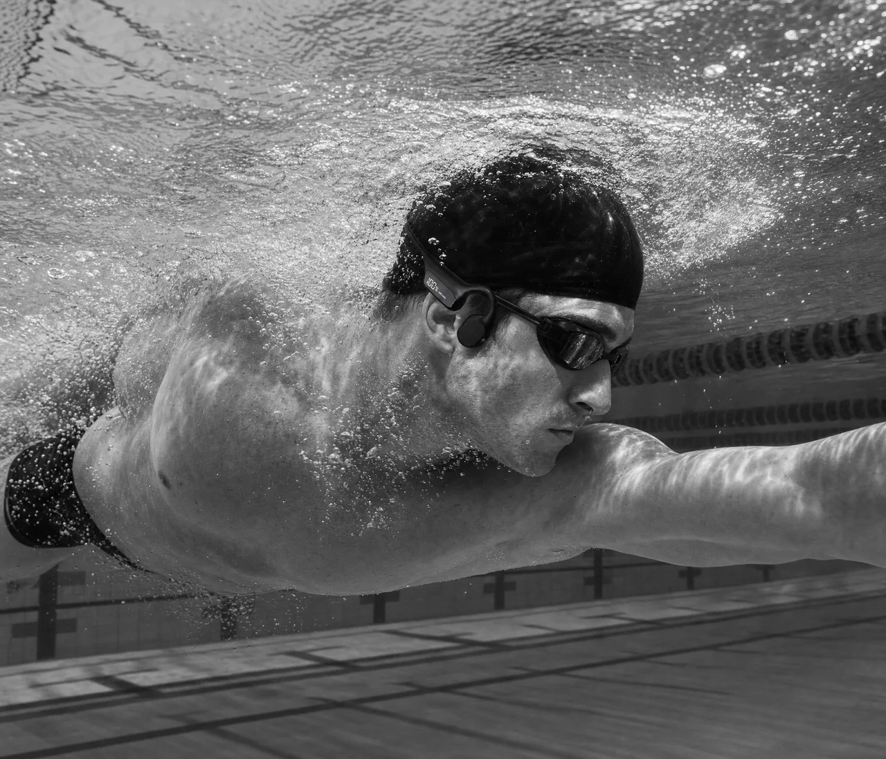 Swimmer underwater mid-stroke wearing the BSA-01